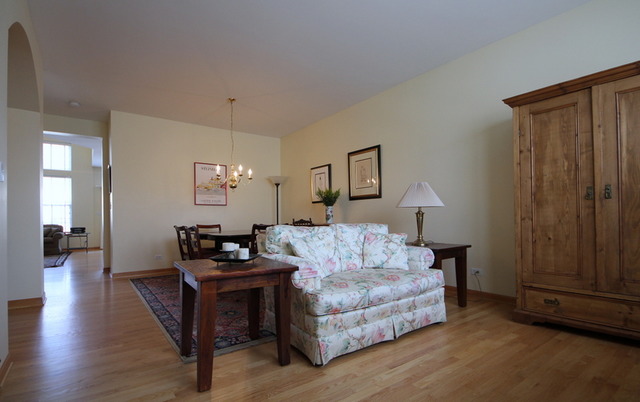 1283 Georgetown Way Vernon Hills, IL 60061 - Photo 4 of 25 a living room with furniture and wooden floor
