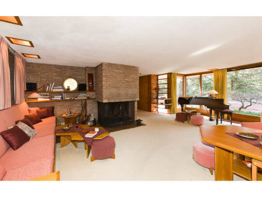 4646 Spring Brook Road Rockford, IL 61114 - Photo 5 of 11 a living room with furniture a fireplace and large windows