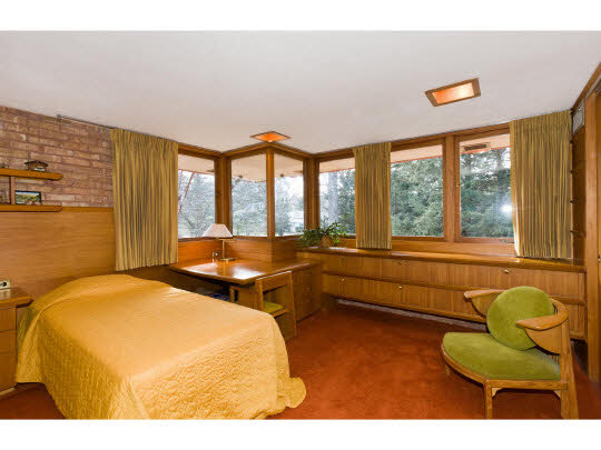 4646 Spring Brook Road Rockford, IL 61114 - Photo 10 of 11 a bedroom with a bed and large windows