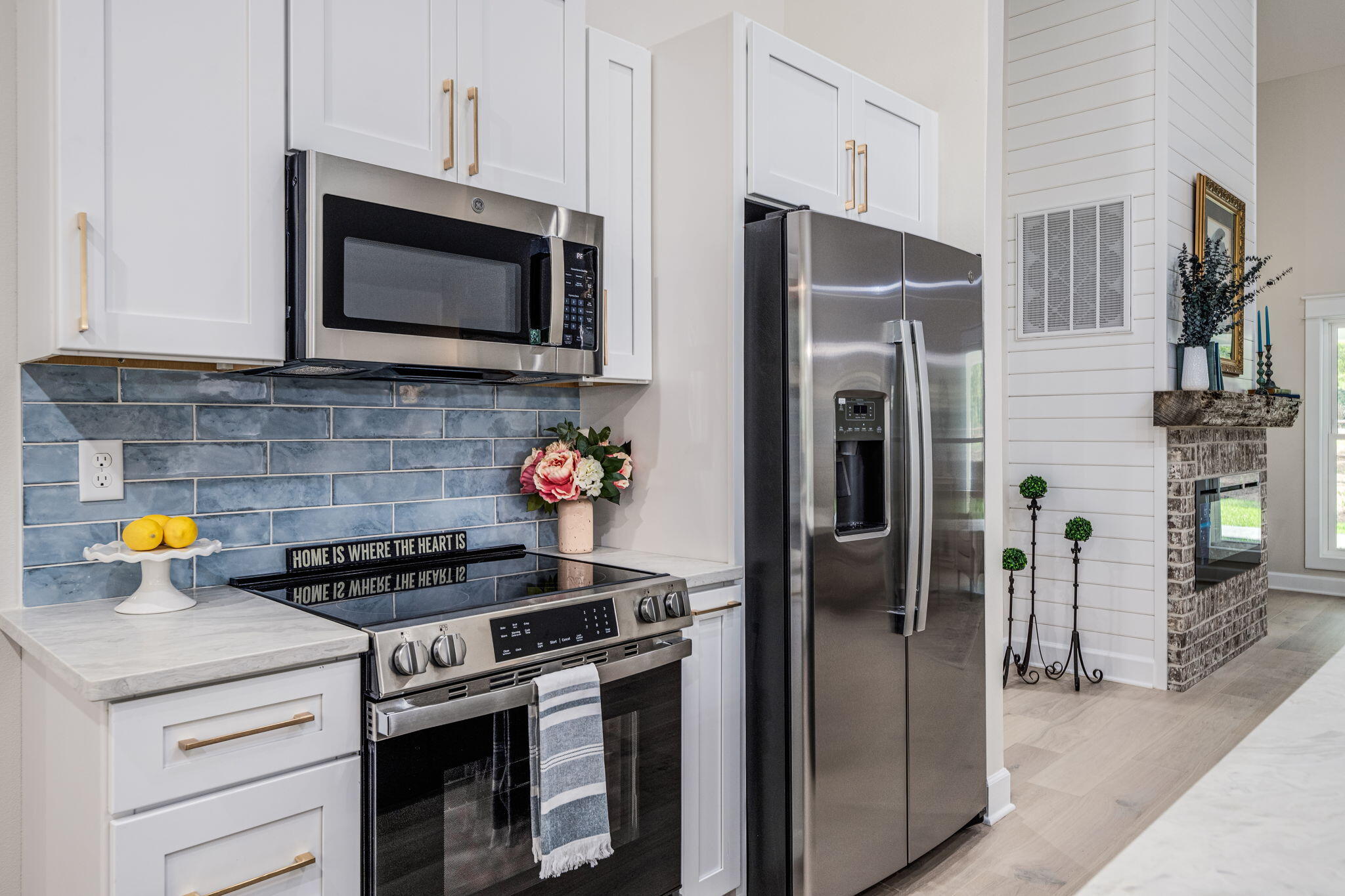 89 Spring Hill Road DeFuniak Springs, FL 32433 - Photo 13 of 73 a kitchen with stainless steel appliances a stove a microwave and a refrigerator