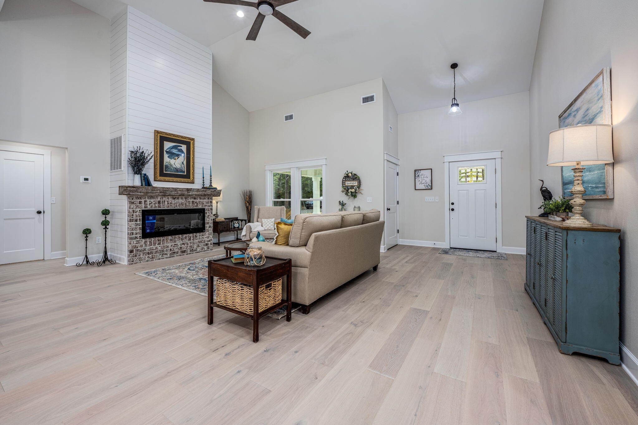 89 Spring Hill Road DeFuniak Springs, FL 32433 - Photo 19 of 73 a living room with furniture and a fireplace