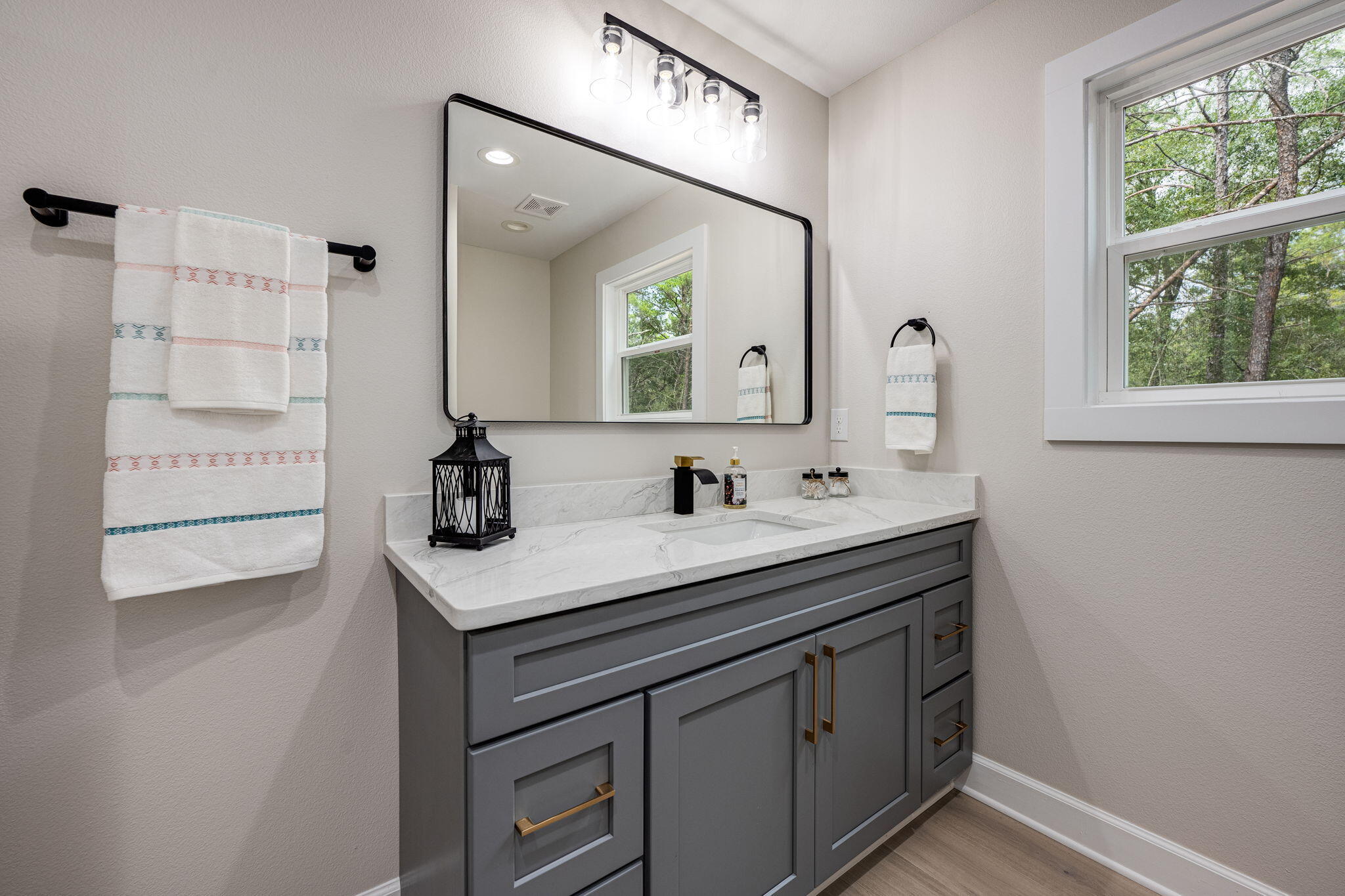 89 Spring Hill Road DeFuniak Springs, FL 32433 - Photo 29 of 73 a bathroom with a sink and a mirror