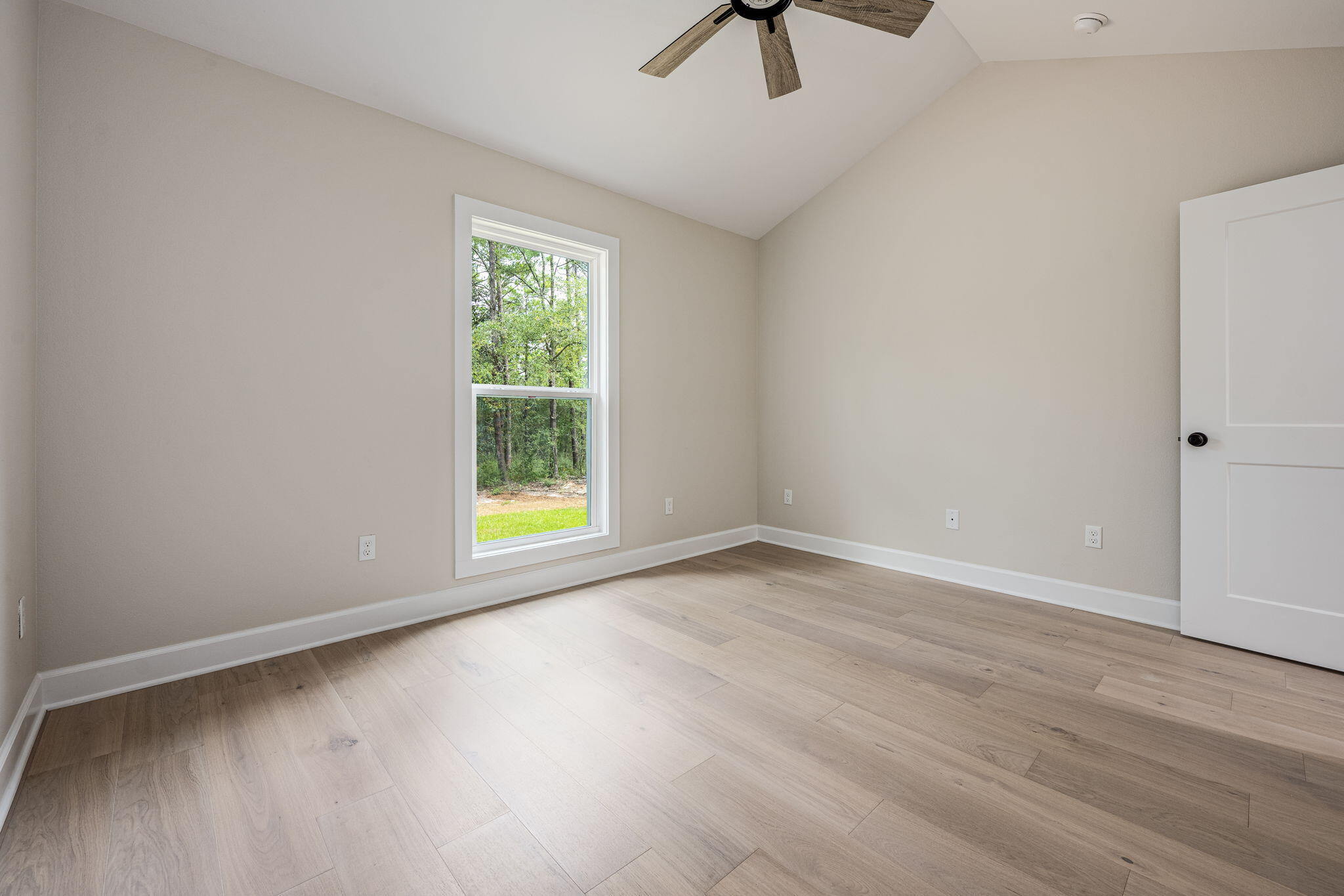 89 Spring Hill Road DeFuniak Springs, FL 32433 - Photo 35 of 73 wooden floor in an empty room with a window