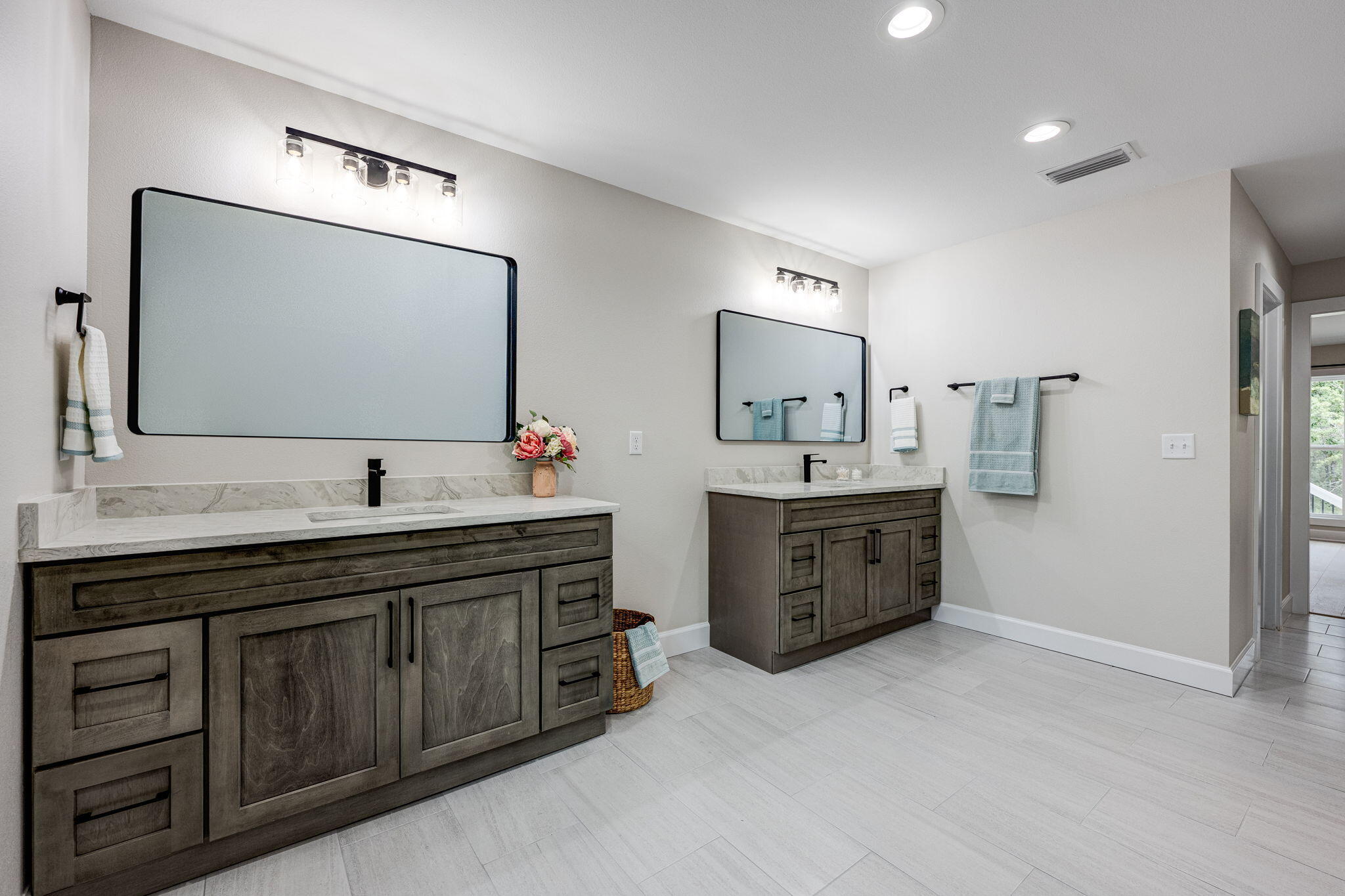 89 Spring Hill Road DeFuniak Springs, FL 32433 - Photo 44 of 73 a spacious bathroom with a double vanity sink and mirror