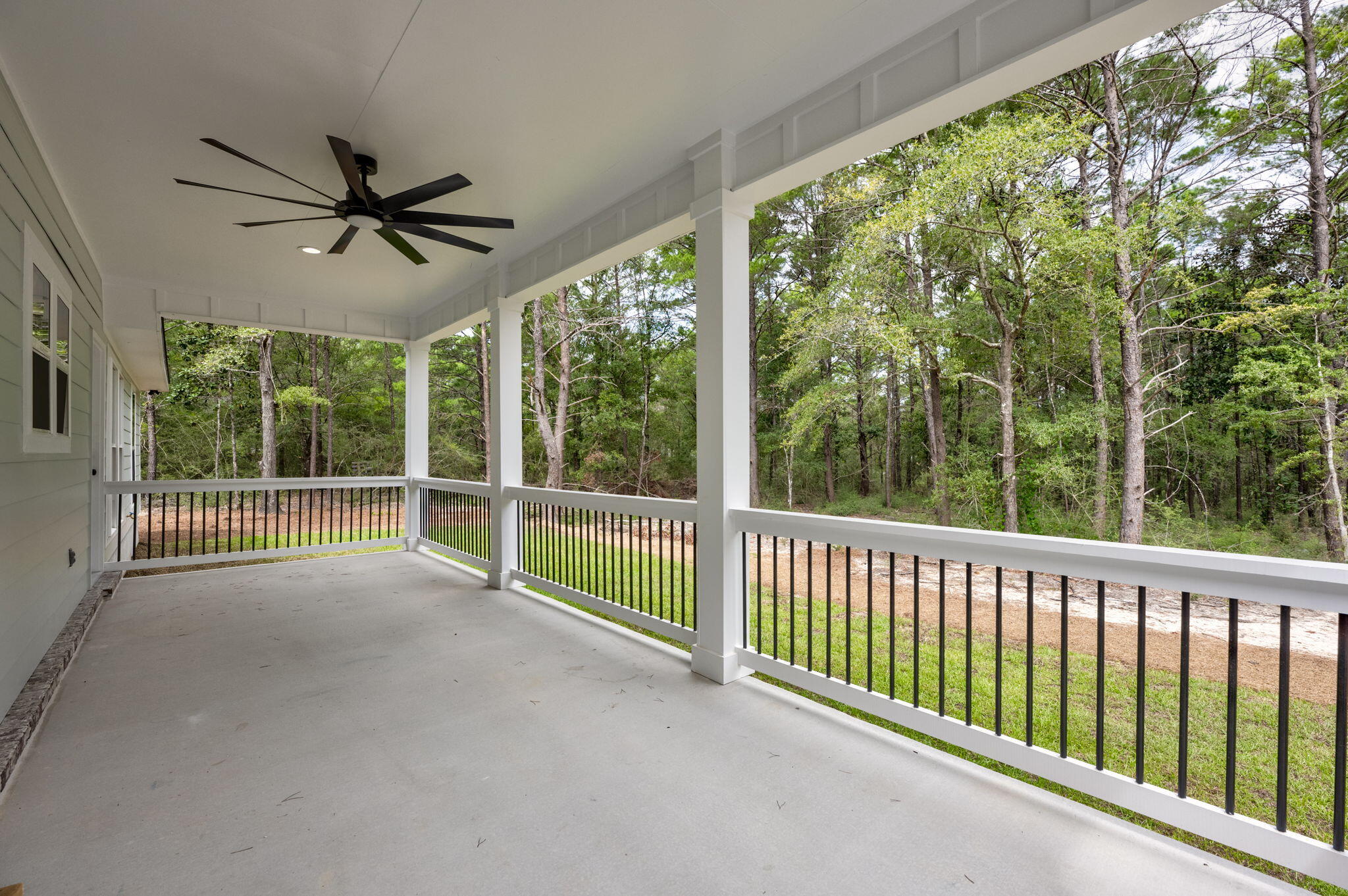 89 Spring Hill Road DeFuniak Springs, FL 32433 - Photo 61 of 73 a view of a porch with a floor to ceiling window