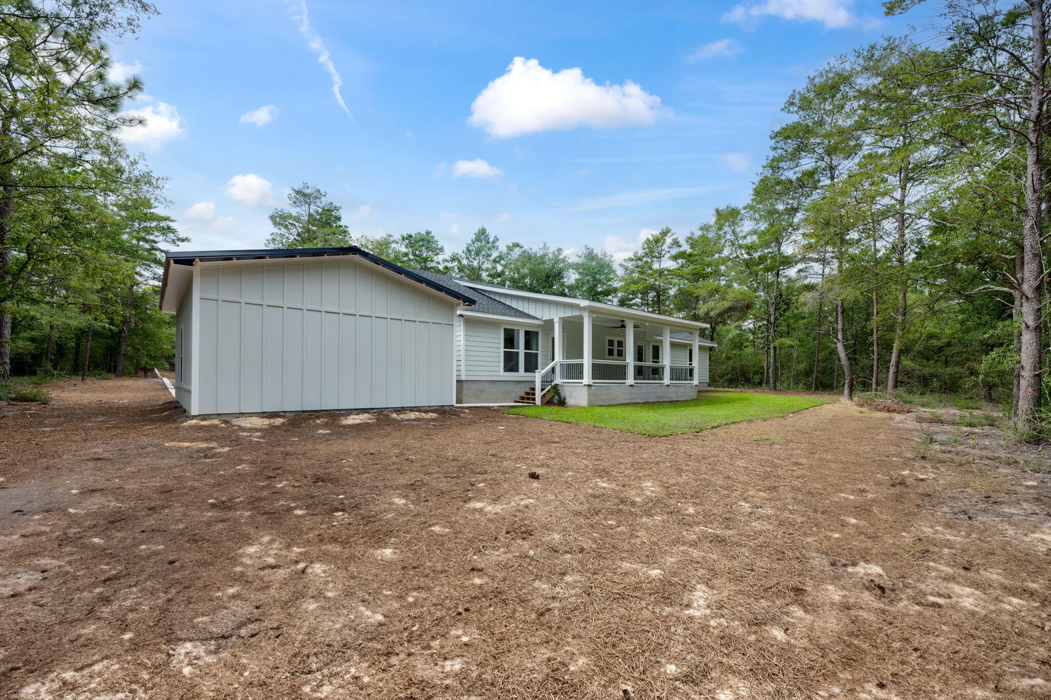 89 Spring Hill Road DeFuniak Springs, FL 32433 - Photo 65 of 73 a view of a house with a backyard and yard