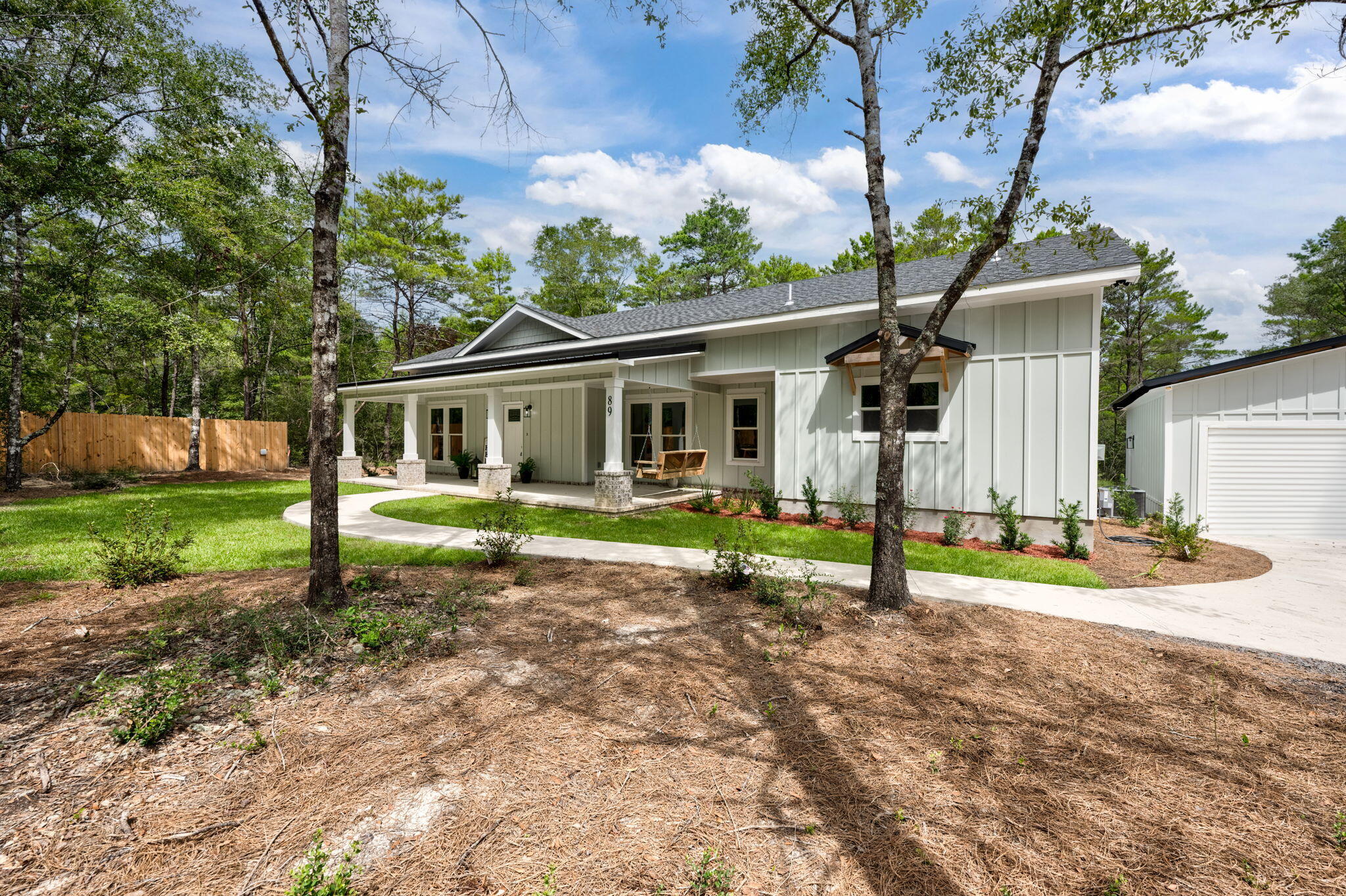 89 Spring Hill Road DeFuniak Springs, FL 32433 - Photo 70 of 73 a view of a house with backyard and a tree