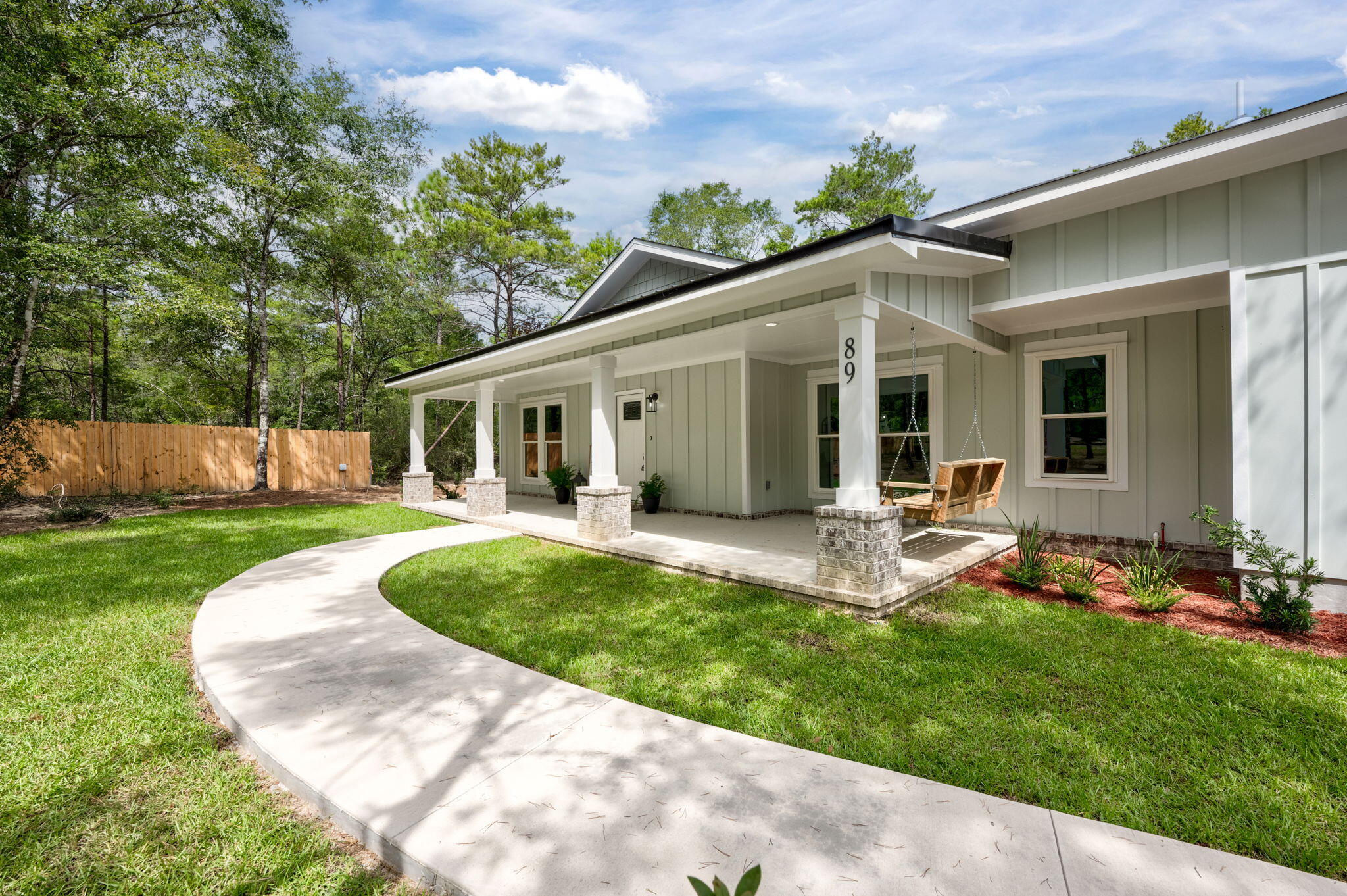 89 Spring Hill Road DeFuniak Springs, FL 32433 - Photo 71 of 73 a view of a house with a backyard and porch