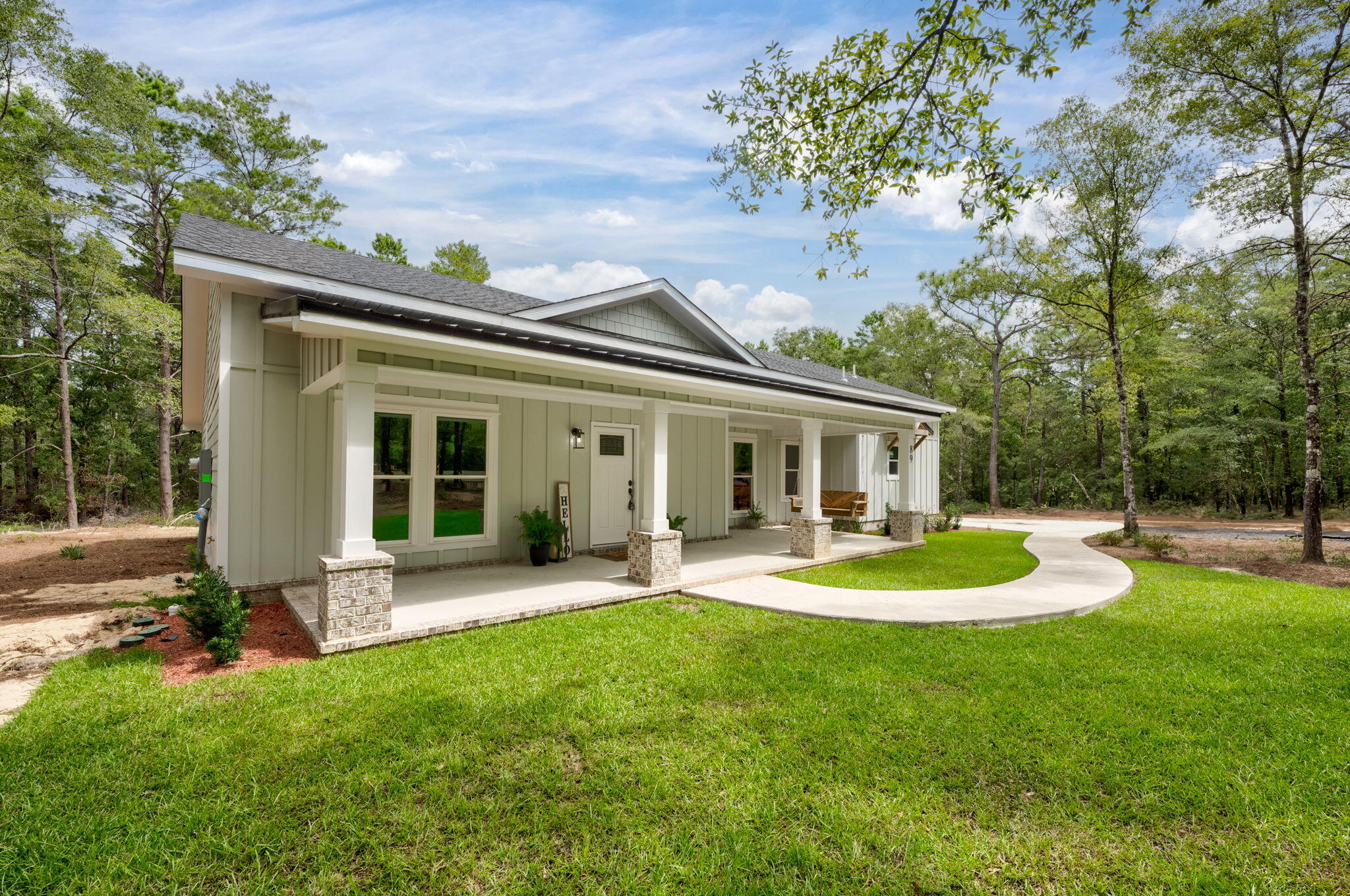 89 Spring Hill Road DeFuniak Springs, FL 32433 - Photo 73 of 73 a view of a house with a yard and sitting area