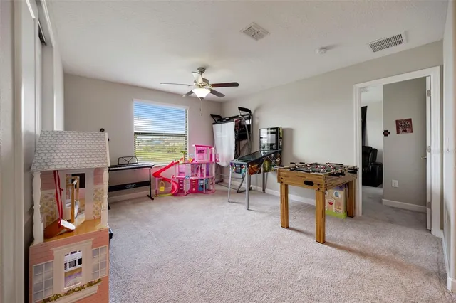 a view of a room with furniture and toys