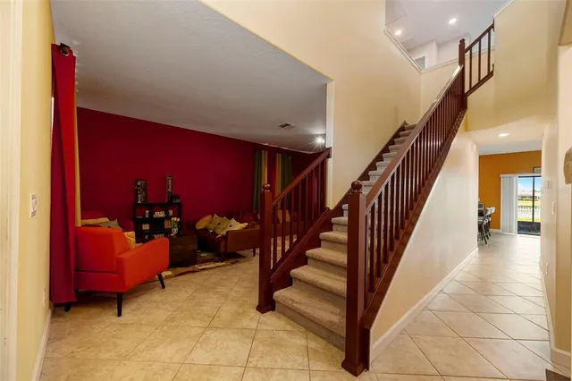 a view of entryway wih livingroom and stairs