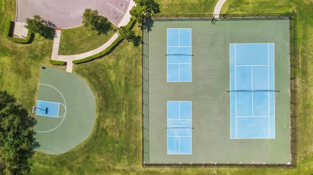 an aerial view of residential house with outdoor space and swimming pool