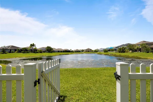 a view of a lake with a house in the background
