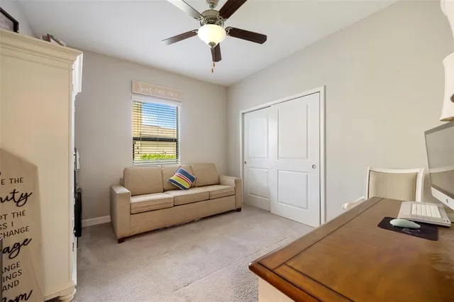 a living room with furniture and a window
