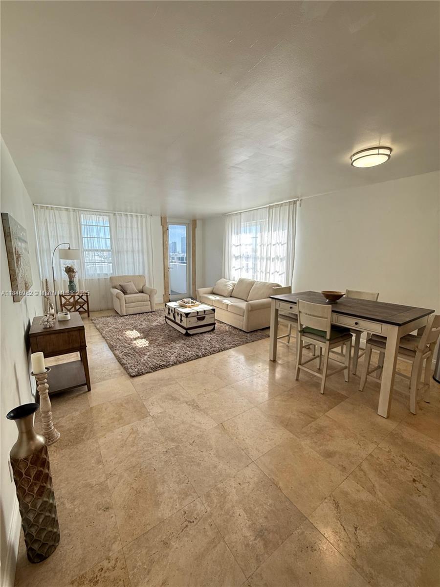 Miami Beach City Center Miami Beach, FL 33139 - Photo 2 of 41 a living room with furniture and a large window