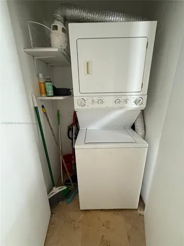 a kitchen with stainless steel appliances a sink and a refrigerator