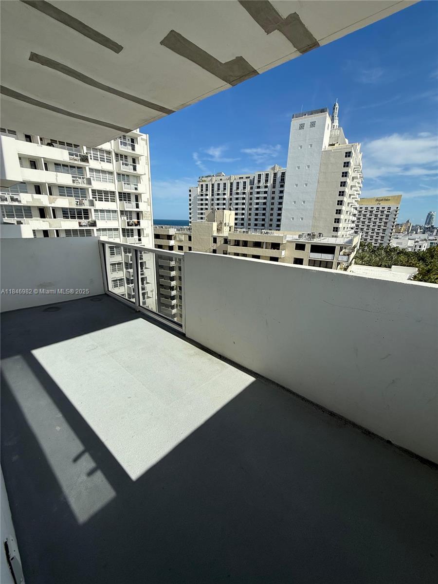Miami Beach City Center Miami Beach, FL 33139 - Photo 35 of 41 a kitchen with a table and chairs