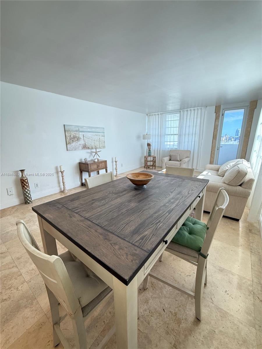 Miami Beach City Center Miami Beach, FL 33139 - Photo 4 of 41 a room with furniture and a kitchen island