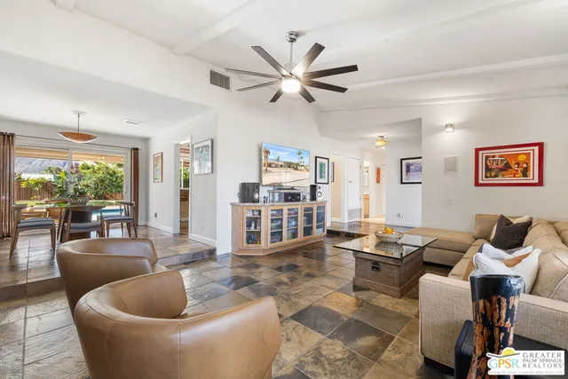 a living room with furniture and a large window