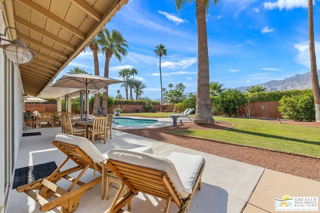 a view of a patio with a table chairs and a patio