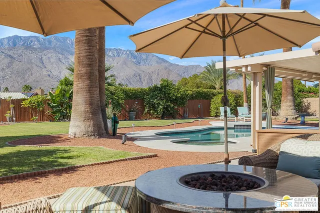 a view of a swimming pool with a patio