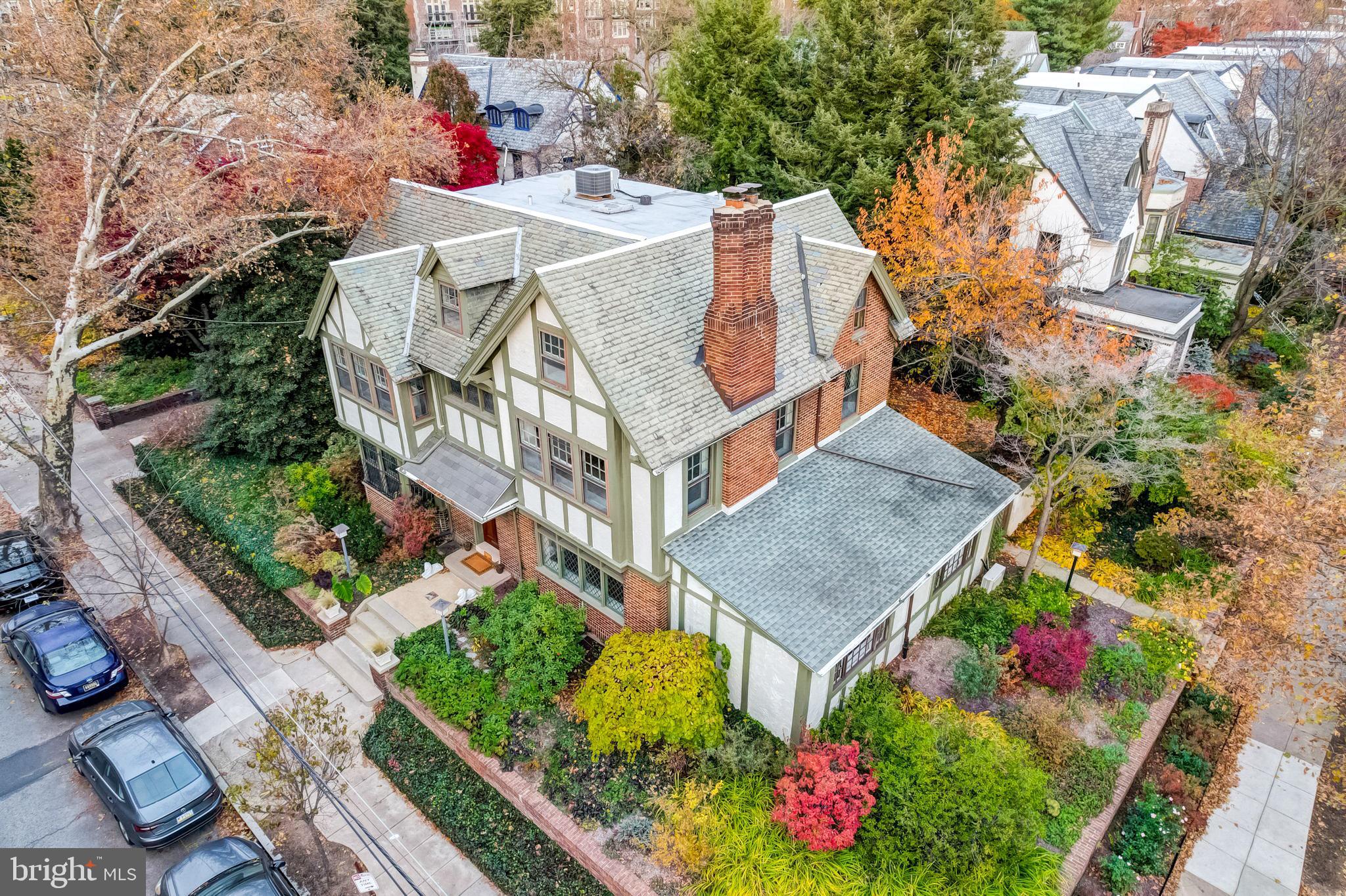 an aerial view of house with yard and outdoor seating