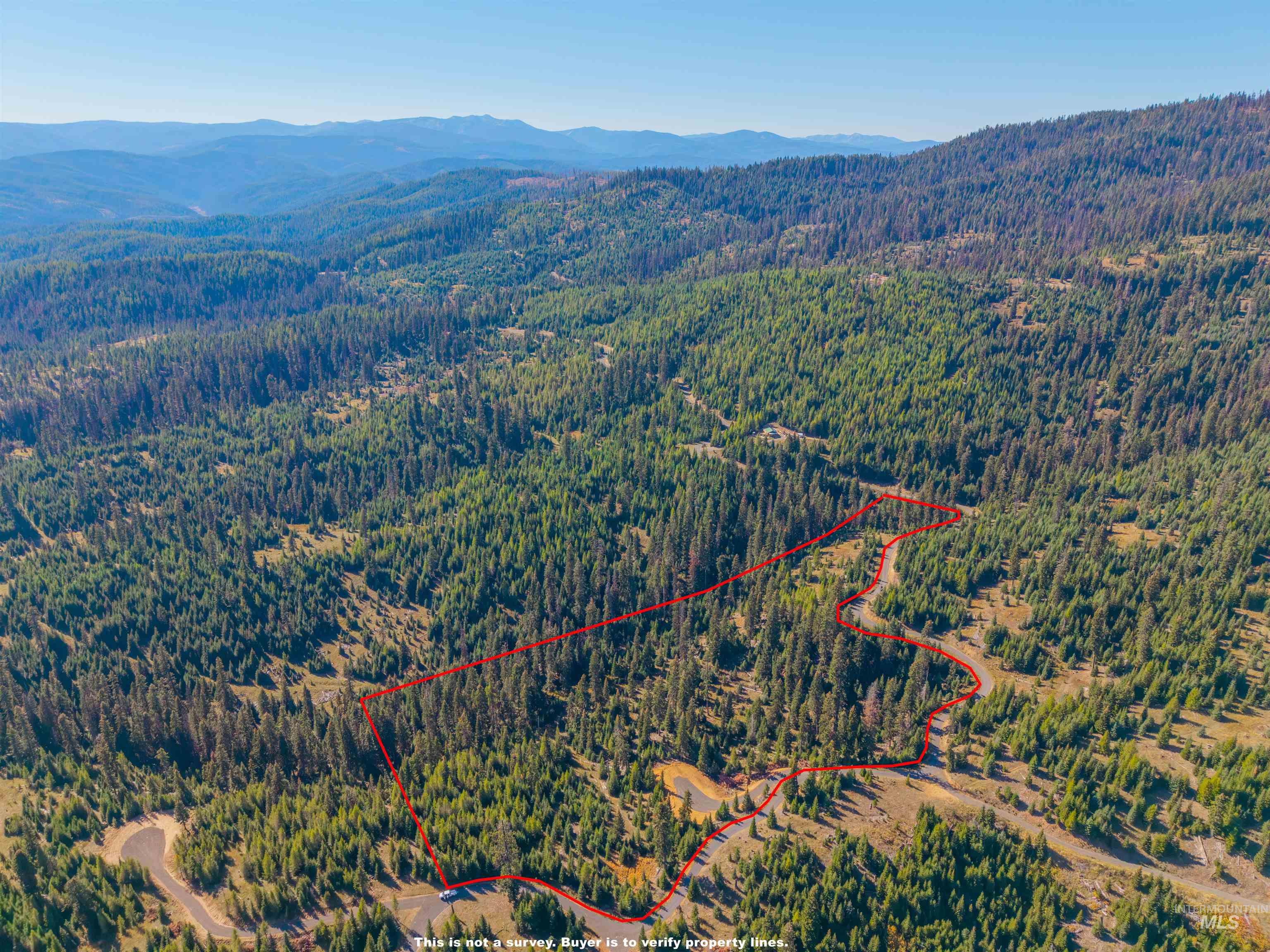 Aerial overview of property's location with mountains and property boundaries highlighted