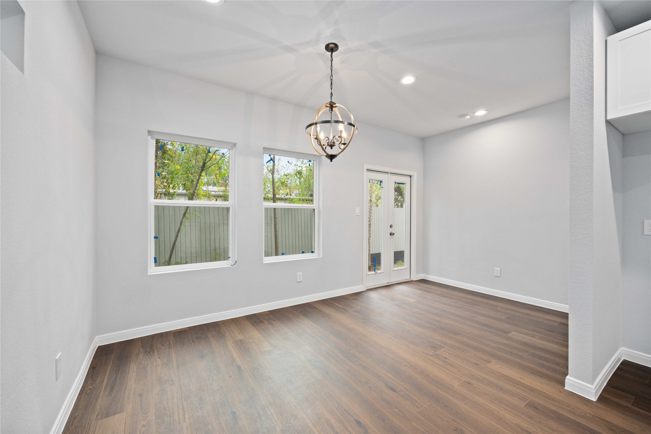 18831 Luminescent Ln Spring Spring, TX 77379 - Photo 12 of 36 a view of an empty room with wooden floor and window