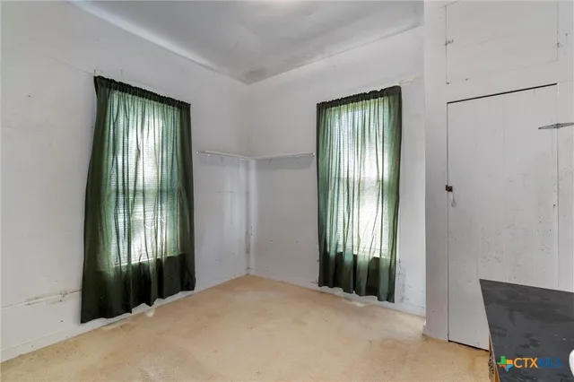 a room with furniture and mirror