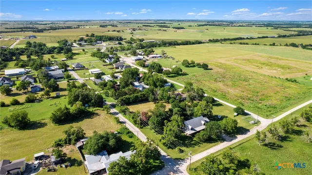 a view of a garden with an ocean