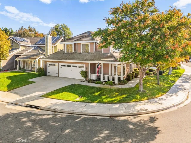 a view of an house with swimming pool and a yard