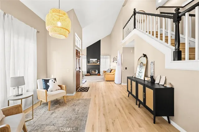 a living room with furniture a rug and a chandelier