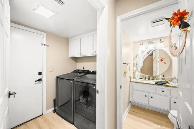 a view of bathroom with a tub sink and mirror