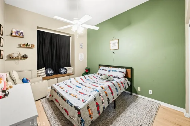 a bedroom with a bed and a table