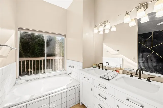 a view of a two chairs in the balcony