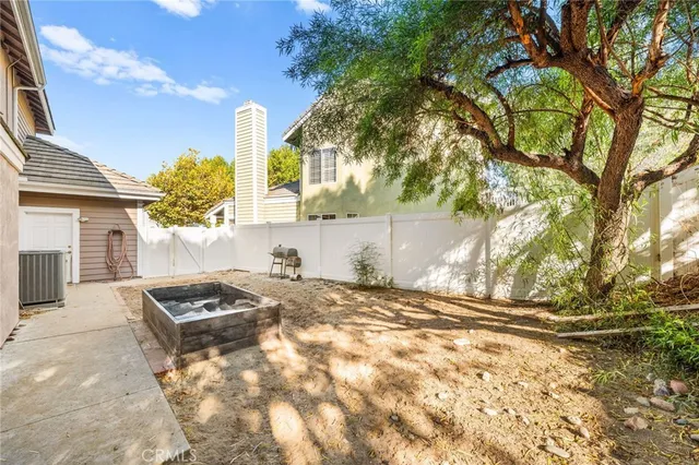 an aerial view of a house with a swimming pool