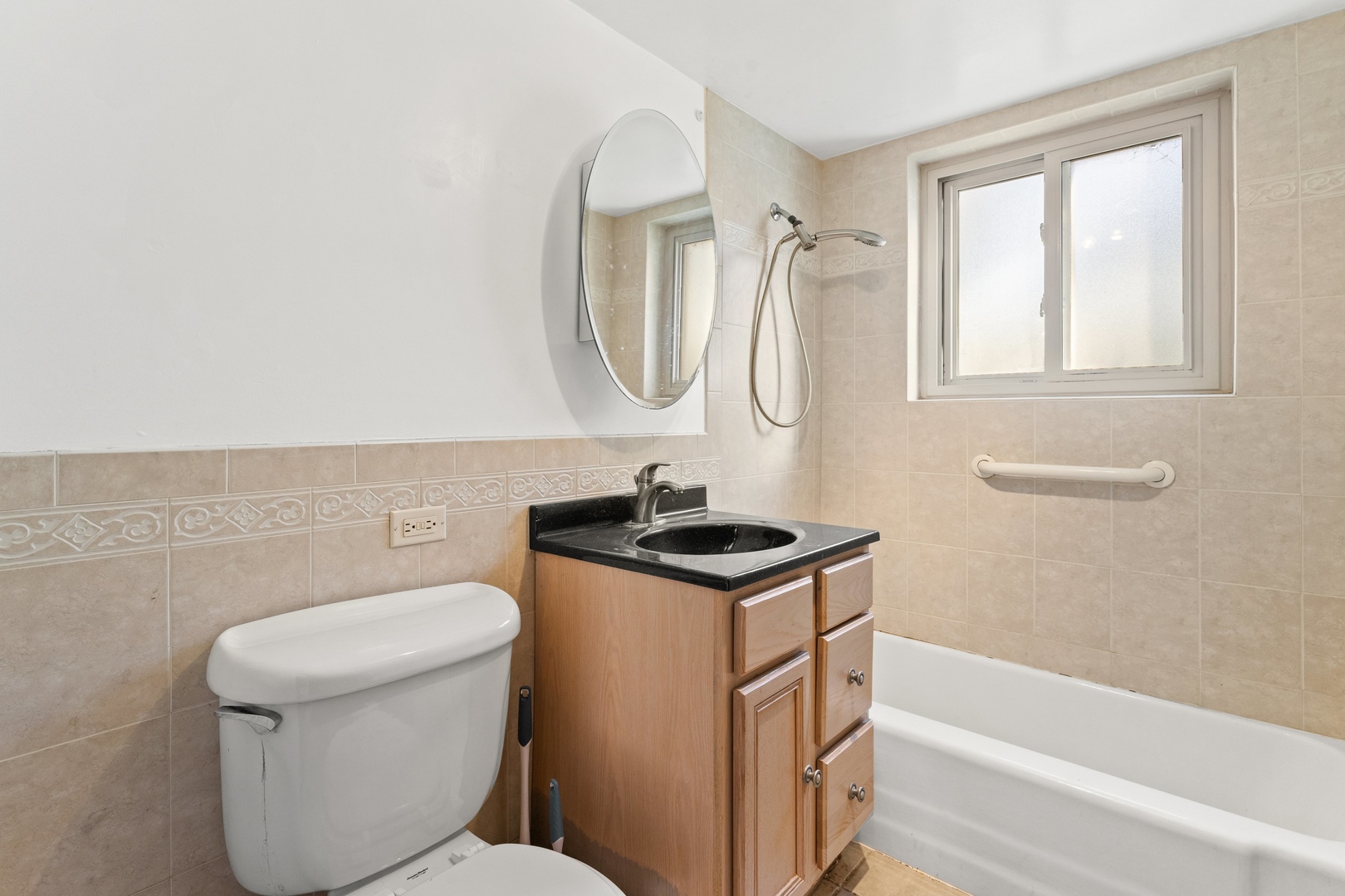 701 Busse Highway, Unit 1A Park Ridge, IL 60068 - Photo 7 of 8 a bathroom with a granite countertop toilet sink and mirror
