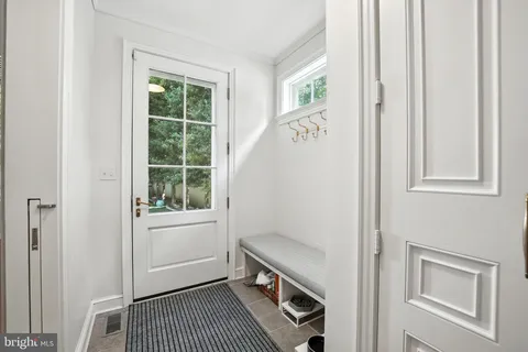 a view of a hallway with an entryway