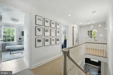 a view of entryway and hall with wooden floor