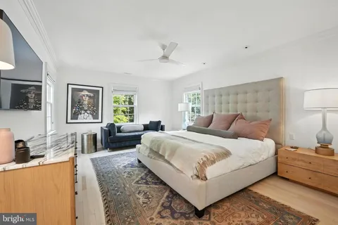 a bedroom with a large bed and a couch