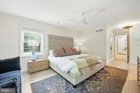 a bedroom with a large bed and a couch