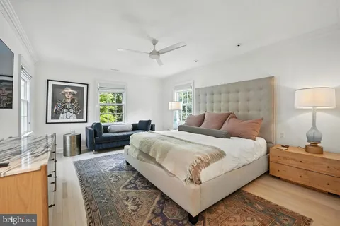 a bedroom with a large bed and a couch