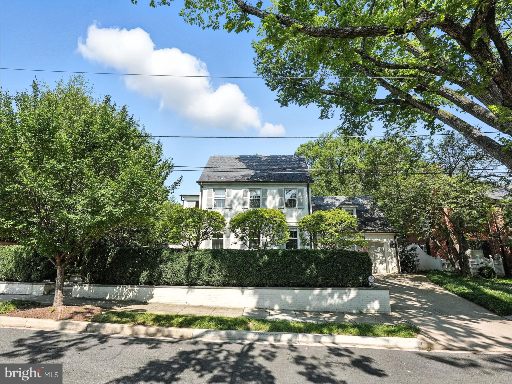 1804 45th Street Northwest Washington, DC 20007 - Photo 3 of 52 a front view of a house with a yard