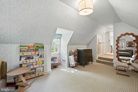 a view of a livingroom with furniture and a window