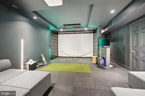 a bedroom with furniture and a large window