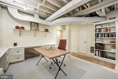 a garden with trees in the background