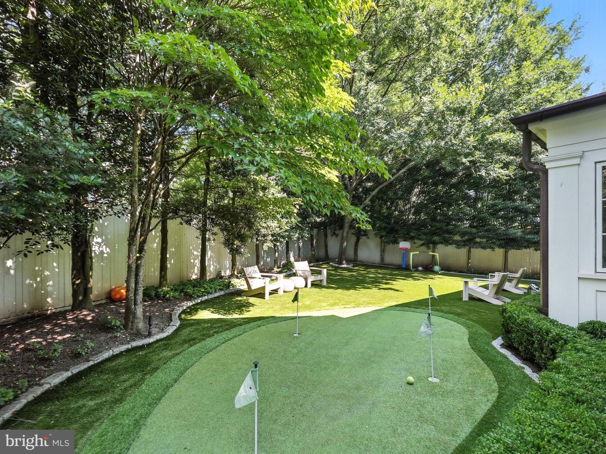 1804 45th Street Northwest Washington, DC 20007 - Photo 51 of 52 a view of a swimming pool with lawn chairs and plants