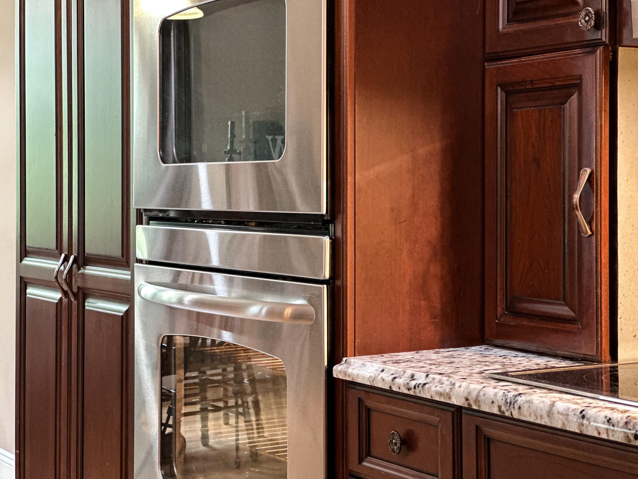 1426 Roman Road Mount Sidney, VA 24467 - Photo 22 of 46 a kitchen with granite countertop cabinets and refrigerator