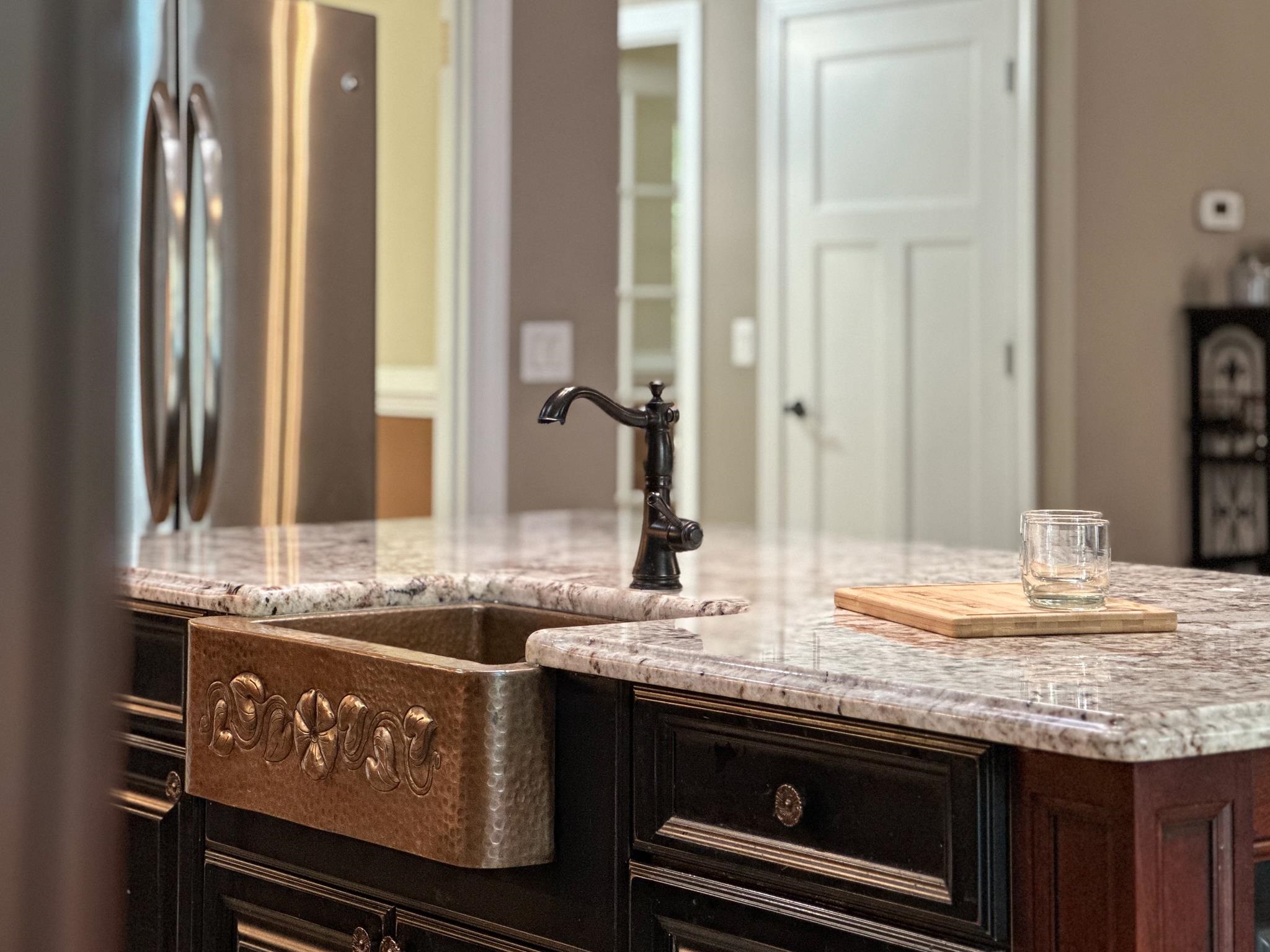 1426 Roman Road Mount Sidney, VA 24467 - Photo 25 of 46 a kitchen with granite countertop a sink and a stove