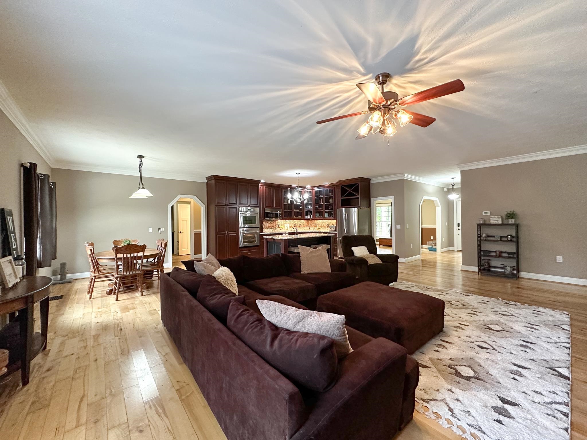1426 Roman Road Mount Sidney, VA 24467 - Photo 30 of 46 a living room with furniture a ceiling fan and a flat screen tv